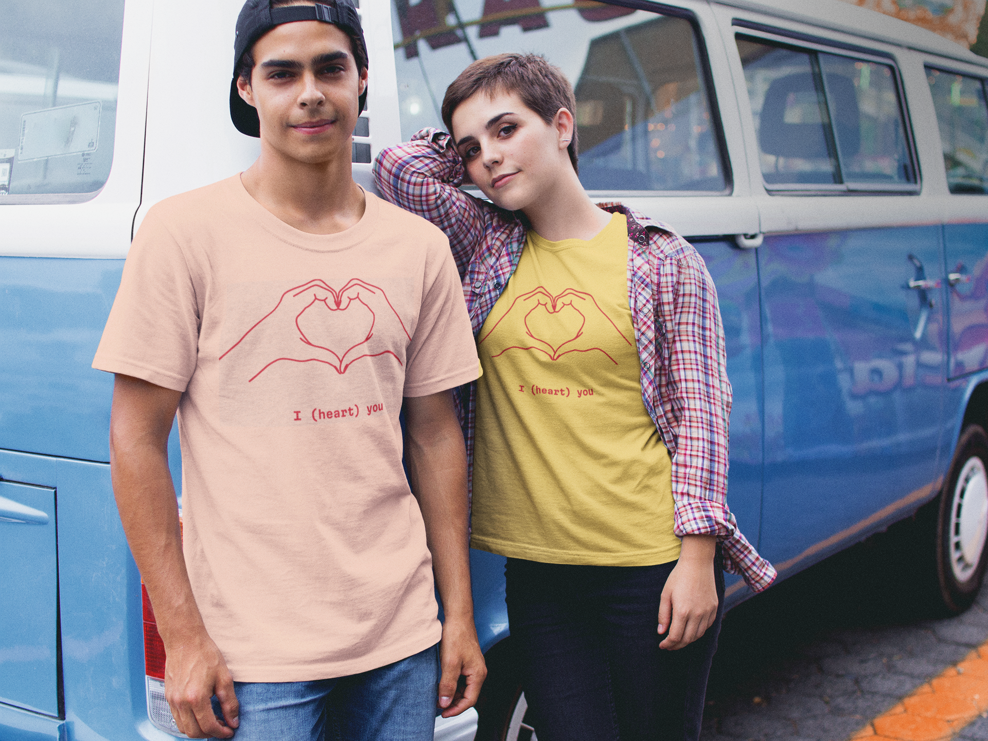 Teens standing by a funky van earing I heart you tshirts